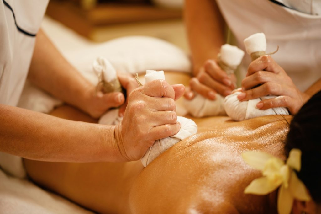 Close-up of detox massage with herbal balls.